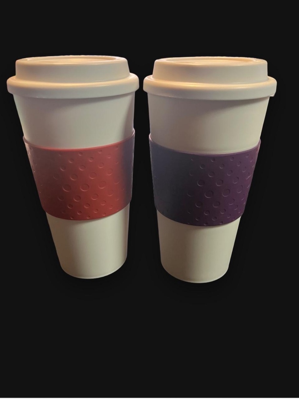 Copco Reusable White Travel Mug pair with red  and Purple Grip Sleeves